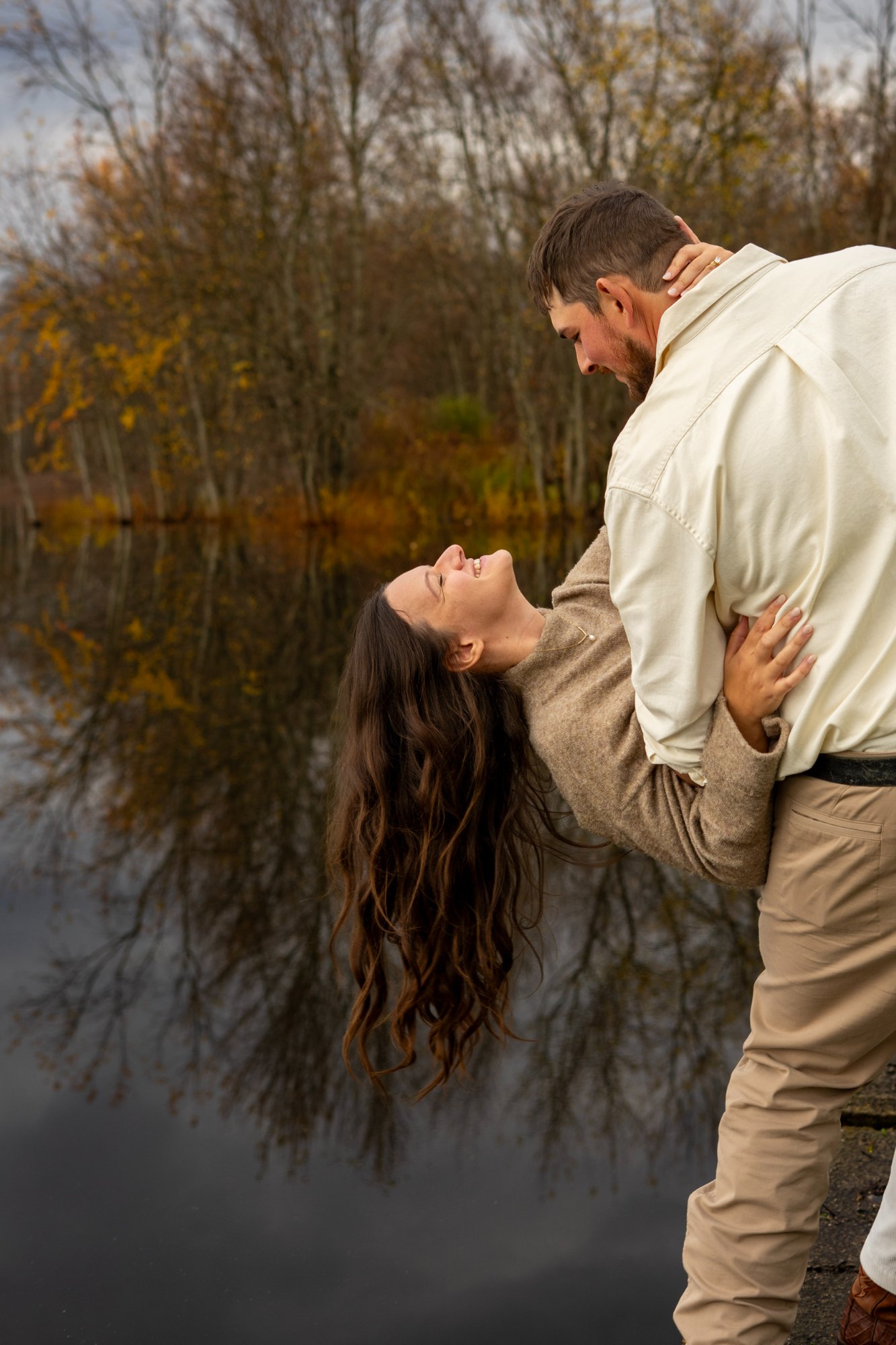 Couple dip by lake