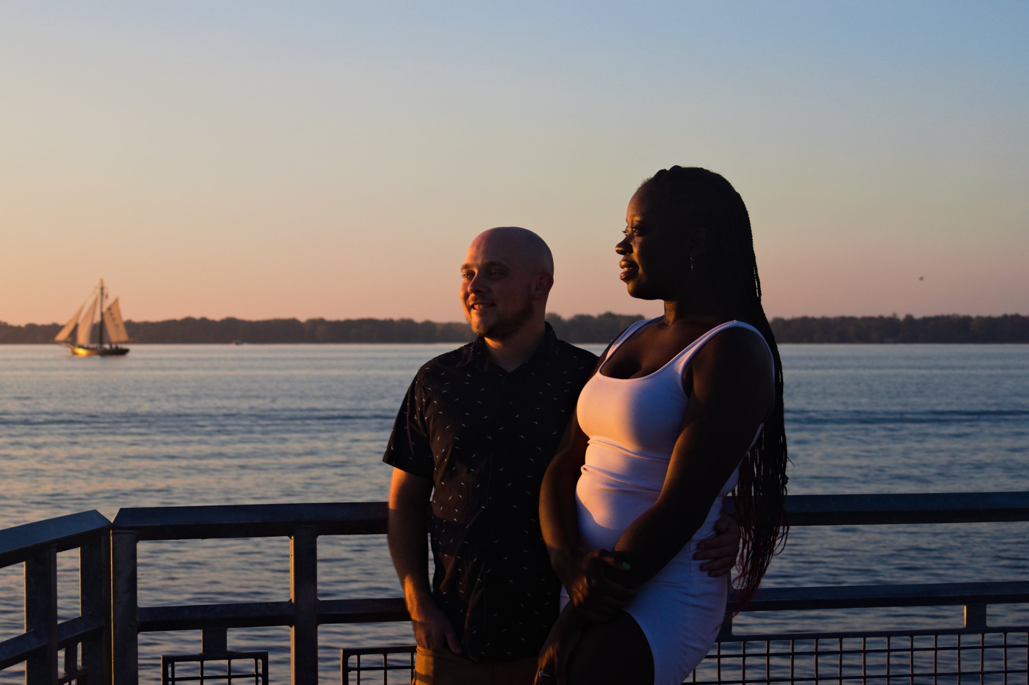 Couple sailboat sunset